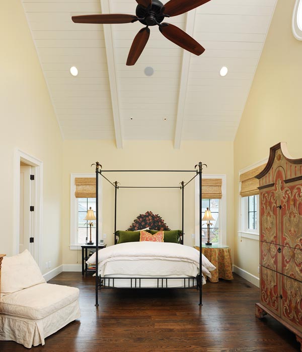 Cozy, eco-friendly bedroom in a Mossy Ridge Southern-charm home, combining luxurious comfort with sustainable materials, bathed in natural light.