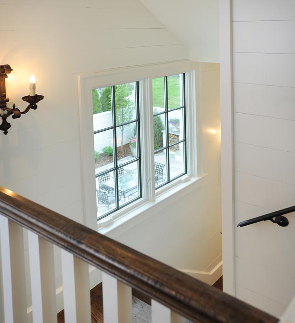 Stairwell view out to the courtyard of this Nashville home built by Mossy Ridge 