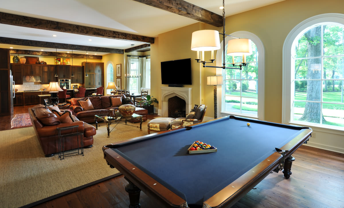 Mossy Ridge's Nashville green home interior featuring a billard table and tons of natural lighting.